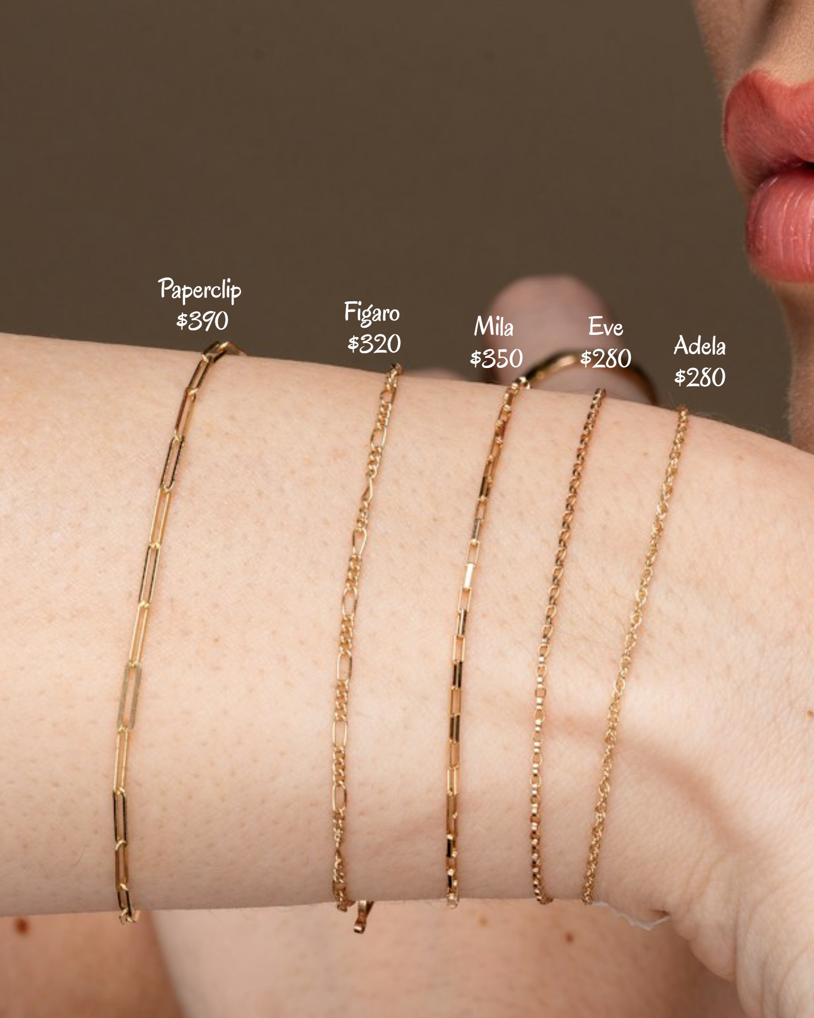Gold chain necklaces on a wrist with price labels