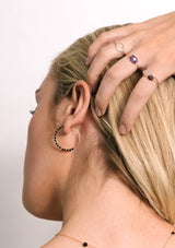 Model wearing Gemstones hoop earrings 